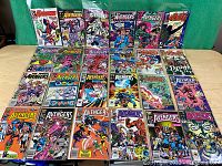 Photo showing 24 issues of The Avengers comics laid out on a table. The comics have colorful illustrated covers with various Avengers characters and appear to be classic Marvel issues.