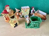 All ceramic items together showing full lot contents against green background