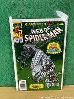Front cover of Web of Spider-Man Giant Sized Issue #100 comic book showing Spider-Man in silver armor with chains.