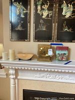 Wide view of mantle showing the clock, candles, amber bowl, and notecard holder.