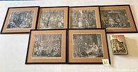 Six framed black-and-white etching prints and a hardcover book titled "Hogarth" by Jenny Uglow displayed on a white surface