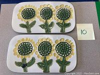 Photo showing both vintage ceramic trivets side by side on a table with a note indicating quantity 10 (likely lot number)