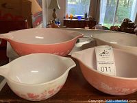 Overview shot of all four Pyrex Gooseberry bowls arranged on table