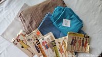 Overview of all fabric pieces and sewing patterns included in the lot