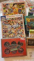 Overview of games and puzzles including 'The 1980's' 1000-piece puzzle and Metal Puzzle Collection