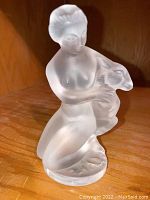 Front view of the frosted Lalique crystal figurine showing the woman holding the deer.