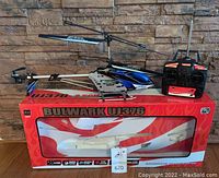 Bulwark UJ376 RC helicopter with remote controller on original box, showing front view and set contents.