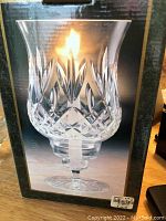Packaged box image showing a lit Crystal Clear Signatures Florence 8.5 inch tall crystal candle lamp with detailed cut patterns and a flickering candle inside.