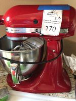 Red KitchenAid Artisan mixer assembled with stainless steel bowl attached