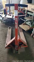 Full view of pallet truck showing forks, handle and frame