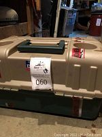 Daiwa fishing tackle box closed with handle and logo visible