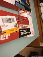 Box packaging with partial product details visible including the 11-v variable speed oscillating multi-tool specifications.