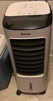 Front view of the grey and black portable air cooler unit with horizontal vent slats and Costway branding on the front.