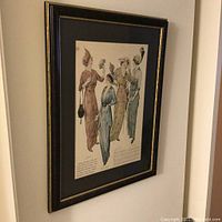 Framed and matted French Victorian fashion advertising print depicting four women in period dresses and hats.