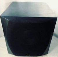 Front view of the black cube-shaped Infinity Entra powered subwoofer with mesh grille and logo visible.