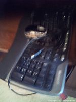 Photo of cables and connectors for solar systems on keyboard.