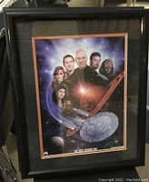 Front view of framed Star Trek: The Next Generation print under glass by Keith Birdsong, featuring main characters and starship Enterprise.