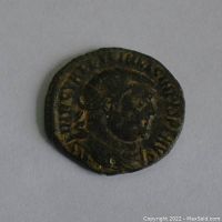 Obverse side showing profile of Roman emperor with surrounding Latin inscription.