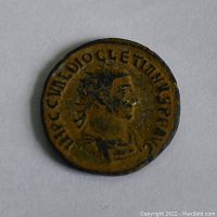 Obverse side of the coin showing Emperor Diocletian's profile with inscribed text around the portrait.