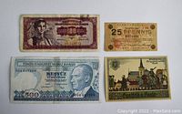 Four vintage paper currency notes laid flat showing front designs and portraits