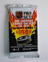 Front view of unopened 1990/91 NHL Pro Set Series 1 hockey trading card pack with promotional graphic and pack details.