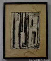 Framed black and white urban scene ink painting showing composition and framing condition.