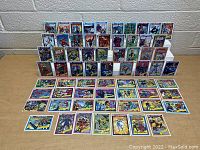 Photo showing Marvel trading cards arranged standing and laid flat on a table.