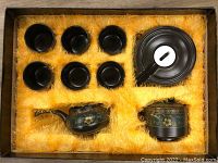 Full Gongfu tea set inside cushioned gift box with yellow soft filling material