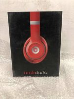 Front view of the black box with red Beats Studio headphones image on the front.