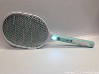 Side view of the electric insect killer bat illuminated near the handle, showing the mesh grid and handle front.