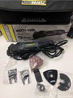 Performax oscillating multi-tool laid out with several accessories and carrying bag visible