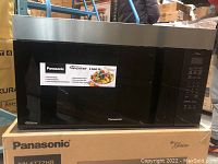 Front view of microwave on original packaging box