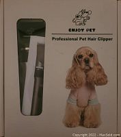 Front of box showing Enjoy Pet Professional Pet Hair Clipper branding with dog image and clipper visible through window.