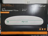 Front view of the box showing the pillow model, brand, moisture wicking feature, and Dri-Tec technology.