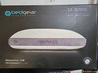 Image of the front packaging of the Bedgear Performance Impulse 2.0 Performance Pillow, showing pillow image and branding.