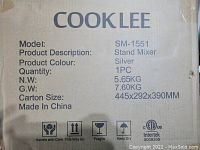 Image of the Cooklee SM1551 stand mixer box showing model, weight, dimensions and care instructions