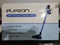 Original packaging box for Elezon Stick Vacuum Cleaner model E600 with product features listed.