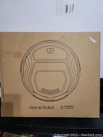Box of Lefant Home Robot vacuum cleaner showing line drawing of vacuum and FreeMove technology branding.