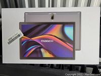 Front of box showing Magch 10 inch tablet with screen and rear camera visible in image on box.