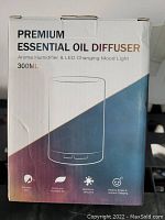 Photo of the diffuser box front showing the product name, type, capacity and key features: moistens skin, purifies and humidifies air, reinforces immunity, revives stress and improves sleeping
