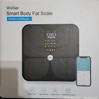 Front of box showing the black Wellue Smart Body Fat Scale with the model number FI2016LB and a smartphone showing app integration.