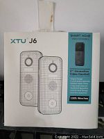 Front view of the XTU J6 2nd Generation Smart Home Video Doorbell box showing product image and key features like wire-free design, 5-level motion detection, 10,000mAh battery.