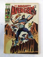 Front cover of The Mighty Avengers #63 comic book showing Clint Barton as Goliath in large blue costume with chains and other Avengers around him.