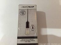 Box front showing Edison bulb pendant light fixture image and branding.