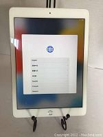 Front view showing touchscreen display in setup mode with language options.