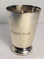 Front view of silver cup showing 'Druids' Club' engraving