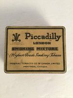 Top view of vintage Piccadilly advertising tin box showing brand name, product description and manufacturer details.