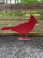 Full view of red cardinal garden silhouette showing its shape, mounting base, and finish.