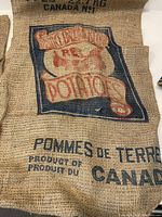 Photo showing burlap bag with PEI Potatoes print, measuring approximately 18x33 inches.