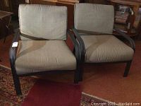 Pair of patio chairs with beige cushions showing front and side views.